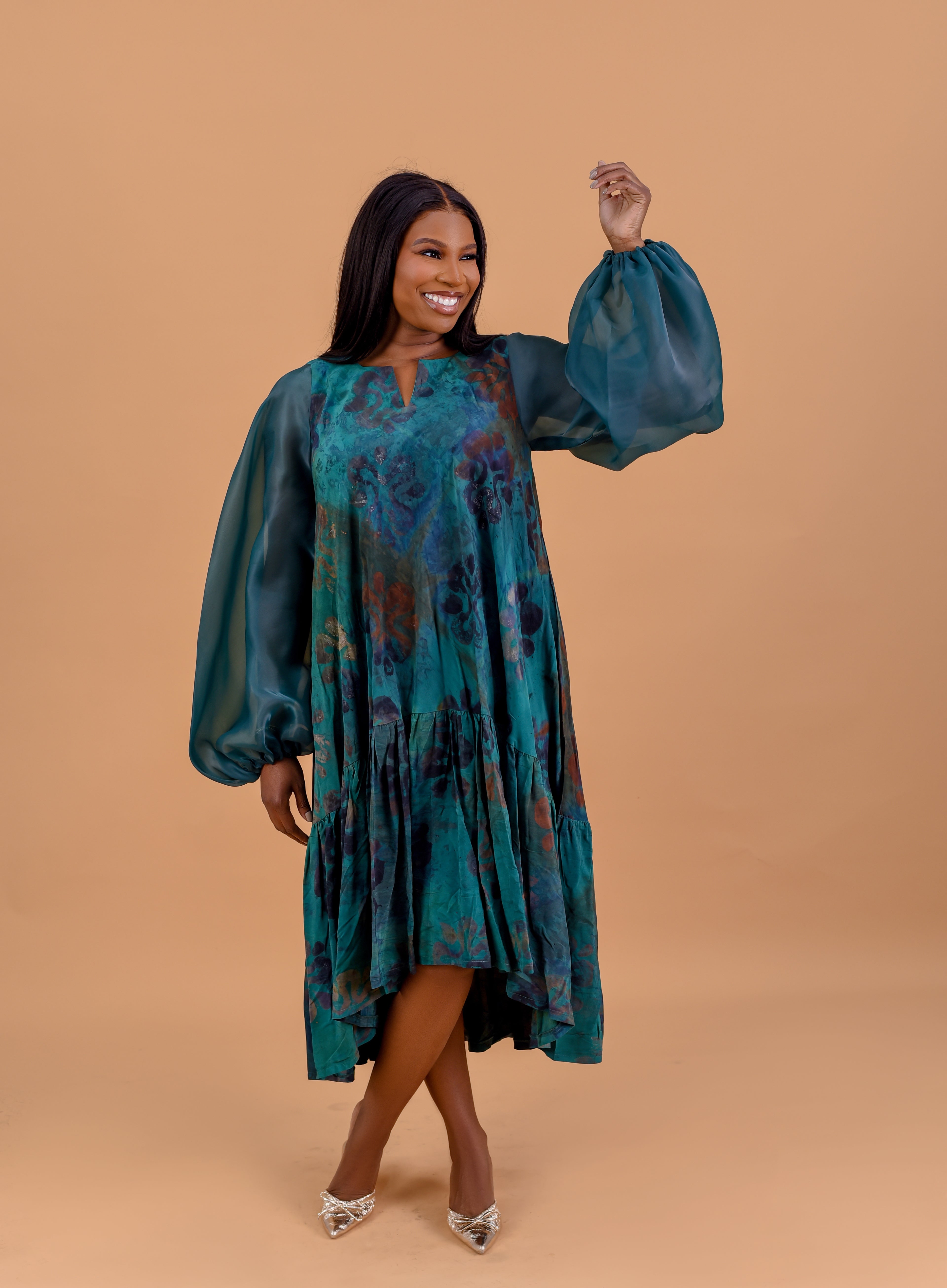 Adire balloon sleeve midi dress in emerald Batik print with sheer organza sleeves by Roseline's Closet
Women's African print midi dress with voluminous balloon sleeves —-emerald teal Batik