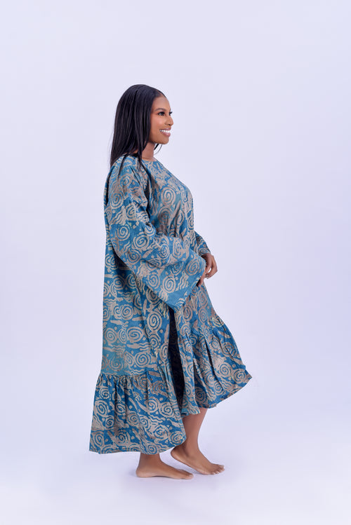 Adire balloon sleeve tiered maxi dress in teal and gold spiral print cotton by Roseline's Closet
Women's African print maxi dress with long balloon sleeves and tiered ruffle hem teal Adire