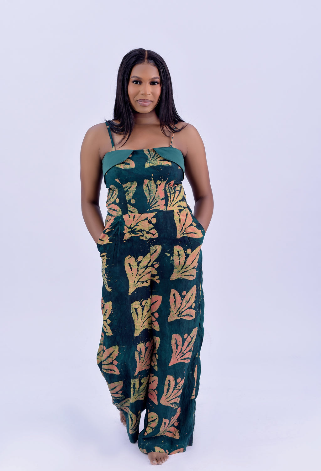 Adire spaghetti strap wide leg jumpsuit in forest green and terracotta floral print by Roseline's Closet
Women's African print cotton jumpsuit with wide leg and side pockets  green Adire floral