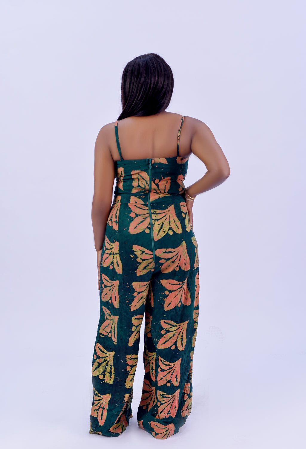 Adire spaghetti strap wide leg jumpsuit in forest green and terracotta floral print by Roseline's Closet
Women's African print cotton jumpsuit with wide leg and side pockets  green Adire floral