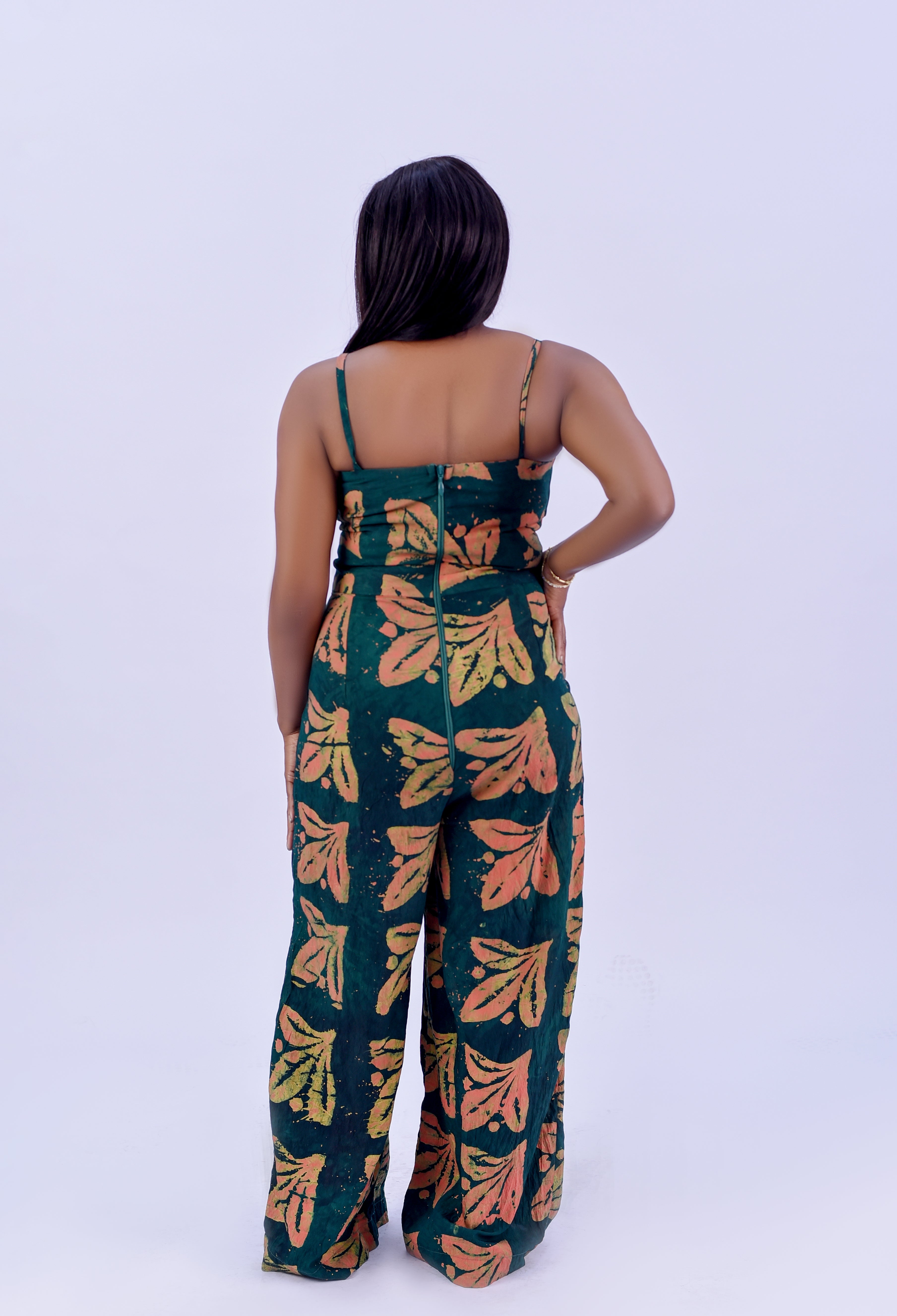 Adire spaghetti strap wide leg jumpsuit in forest green and terracotta floral print by Roseline's Closet
Women's African print cotton jumpsuit with wide leg and side pockets  green Adire floral