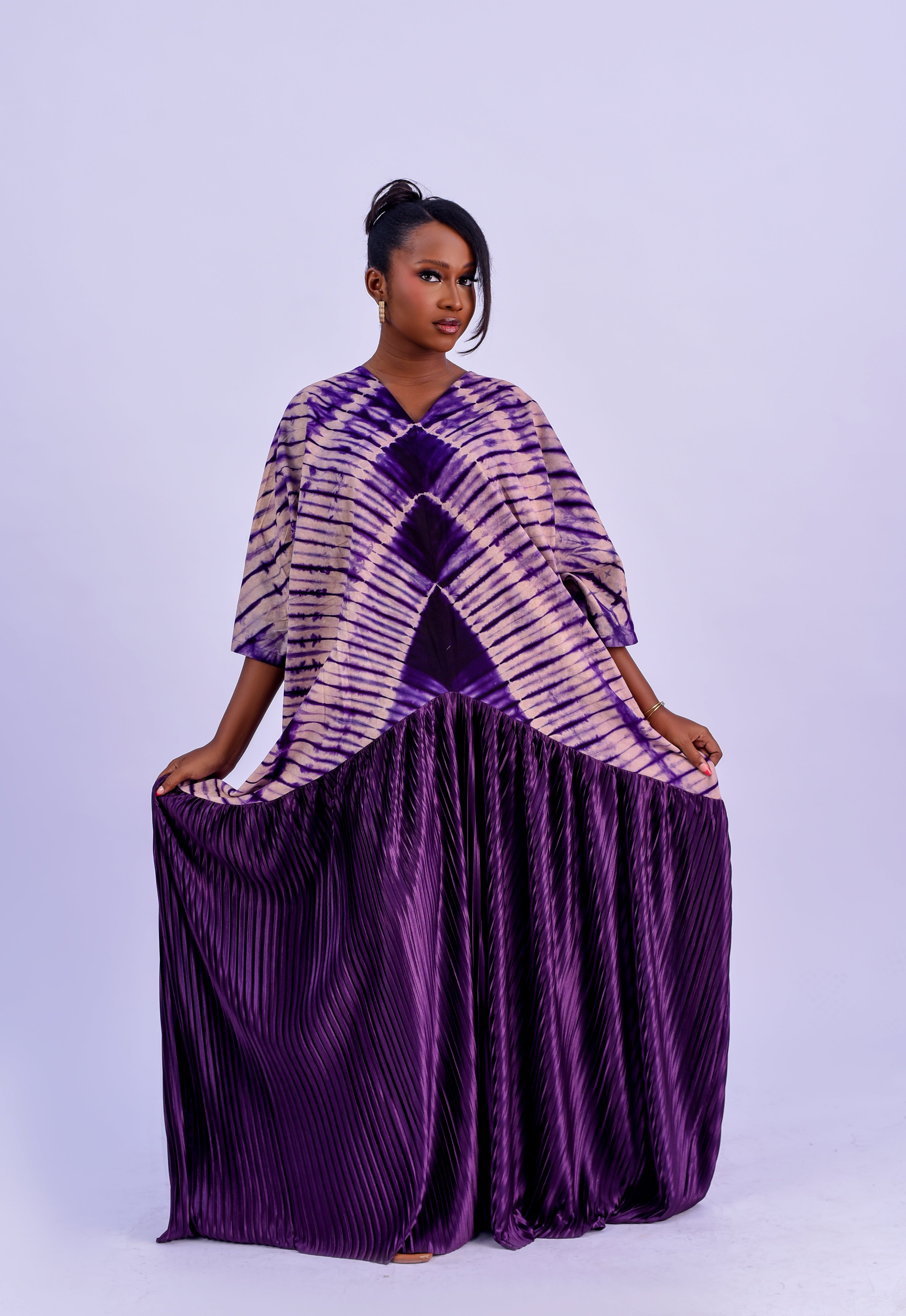 Adire pleated kaftan maxi dress in royal purple tie-dye with floor-length pleated skirt by Roseline's Closet