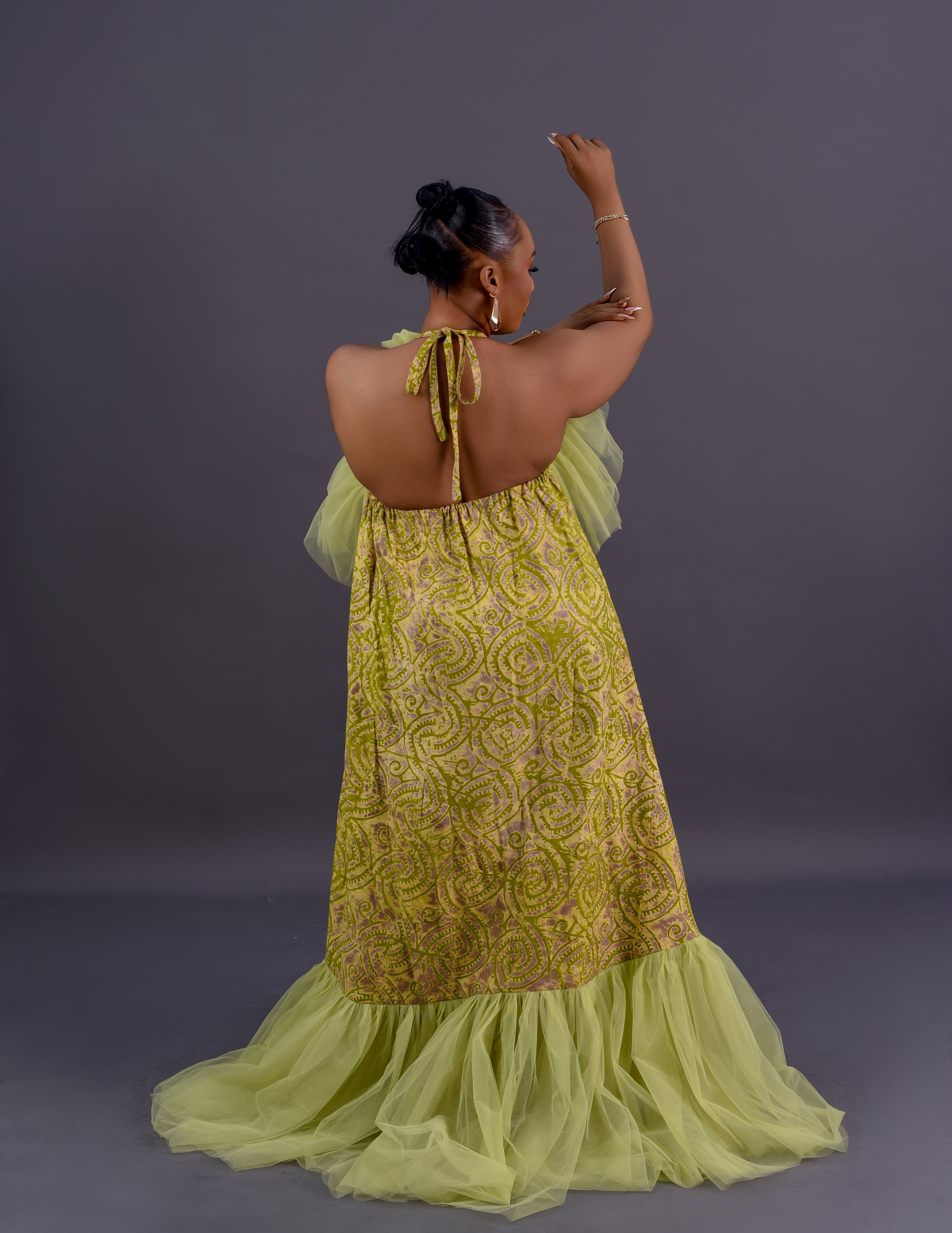 Adire tulle collar halter maxi gown in lime green and gold Adire print with organza ruffle by Roseline's Closet
Women's African print halter maxi gown with dramatic tulle collar and sweeping hem lime green